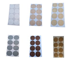 Täckbrickor till att täcka skruvhål till sängskåp